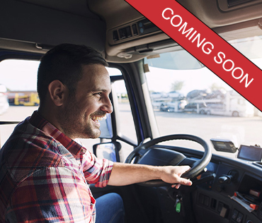 Truck-Driver-Coming Soon Happy truck driver driving down the road